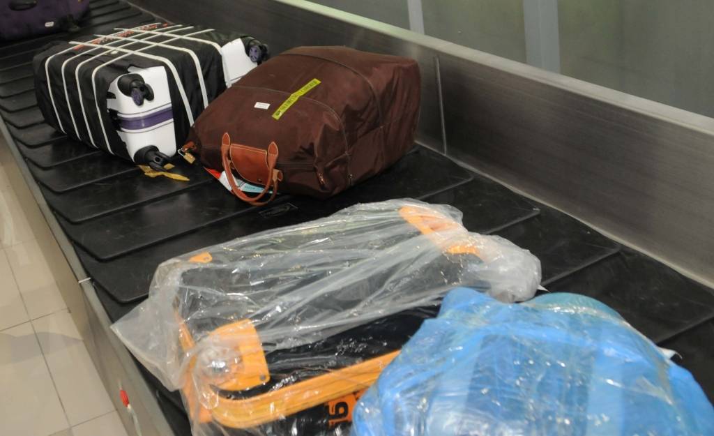 Чехлы на чемодан и багажные ремни: мнения путешественников